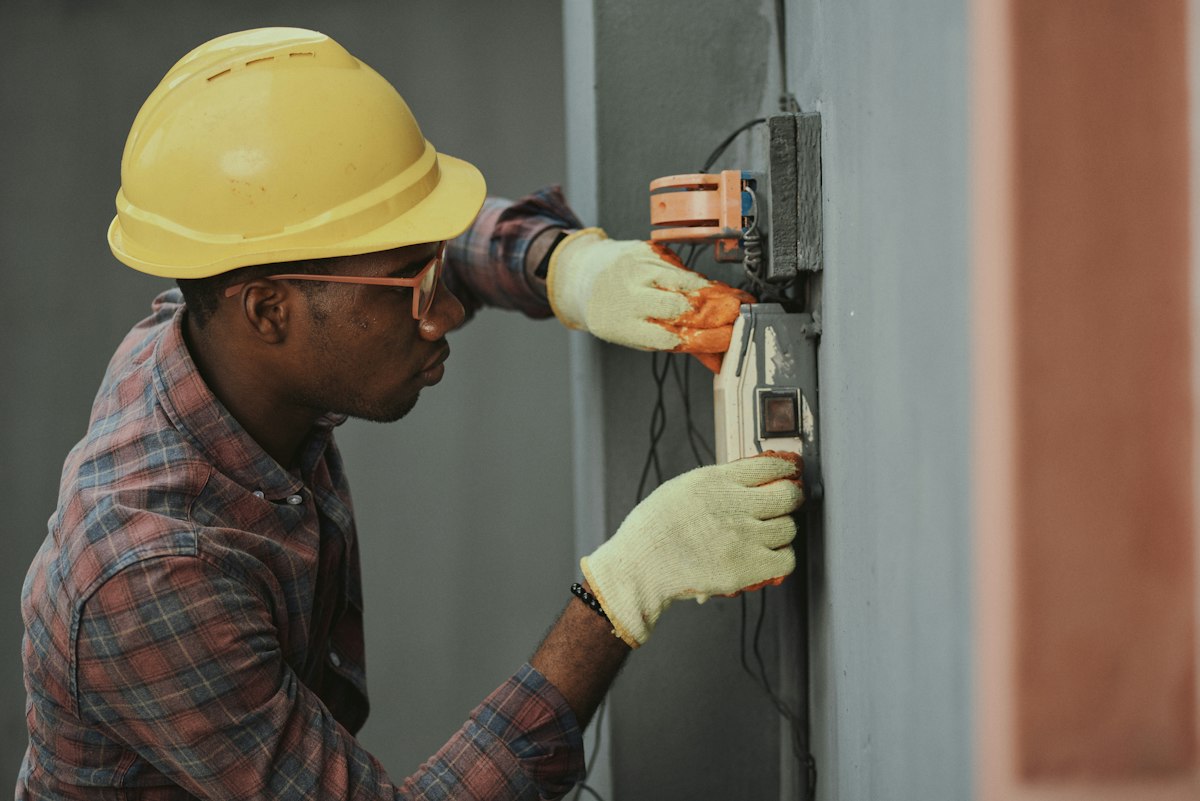 Comfort Air Solutions technician servicing air conditioning cooling system